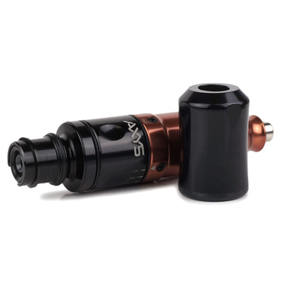 A Burnt Orange Axys Tattoo Pen Machine on a table. Axys Valhalla Pens available at Kingpin.  