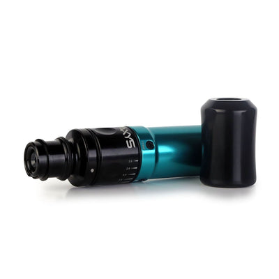 A Teal Axys Valhalla Pen Machine horizontally laying on a table top.  
