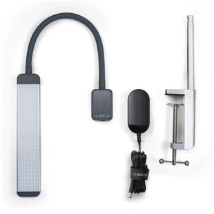 A Glamcor Mono Light Kit for tattoo artists with charger, clamp & light.