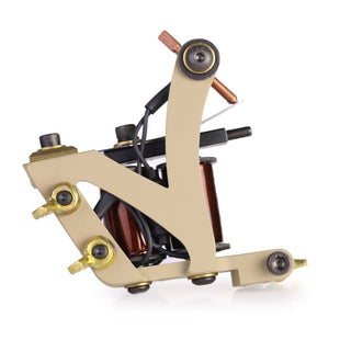 A tan Kingpin “Model N” Shade 9.76oz coil tattoo machine.
