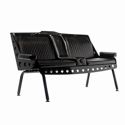 A black Comfort Before Pain Waiting Room Bench for tattoo shops. It features vinyl seats, armrests, built-in cup holders, and a metal frame. 